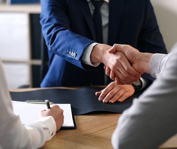 Business owner shaking hands with a bankruptcy attorney